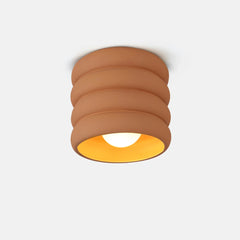 Modern Cylindrical brown ceiling light fixture on a white background