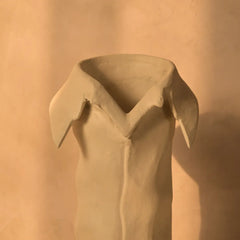 Unique vase design with beige sculptural collar-like rim and hand-textured surface 