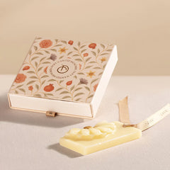Whispering Jasmine - Wax Tablet, daisy wax tablet on ribbon beside floral slide-out box