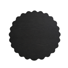 Colonnade Dining Table top view of scalloped round matte black surface with visible wood grain
