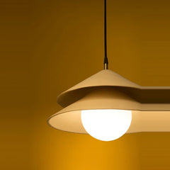 Globe Pendant light close-up of lit globe diffuser under layered ceramic shades