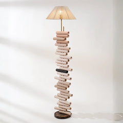 Floor lamp made of stacked cylindrical wooden pieces by Keph Design Studio