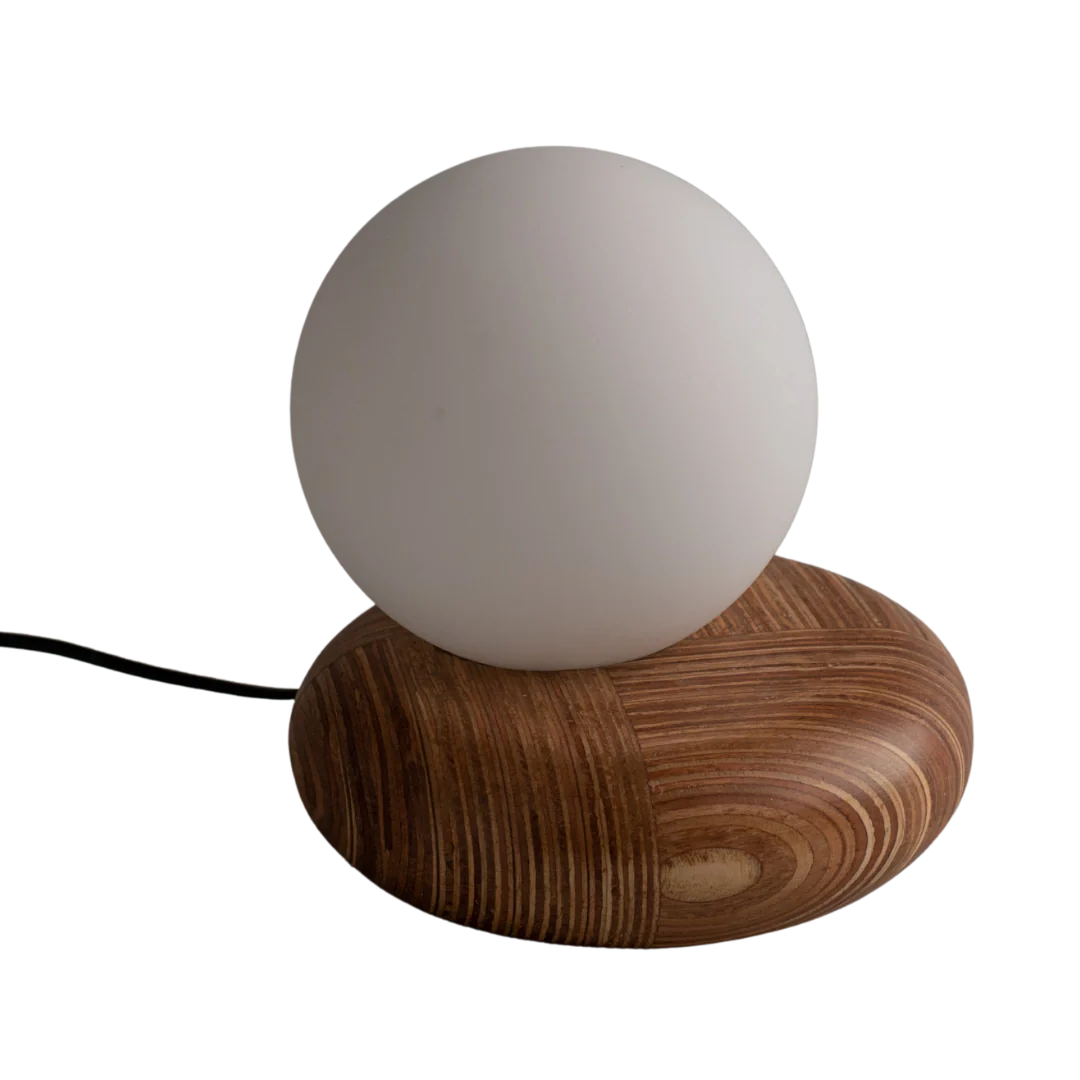 Table lamp with wooden base and white glass spherical shade 
