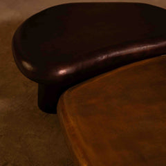Close-up of a brown color coffee table set on a textured surface