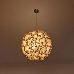 Vyoma pendant light with floral pattern on a brown background
