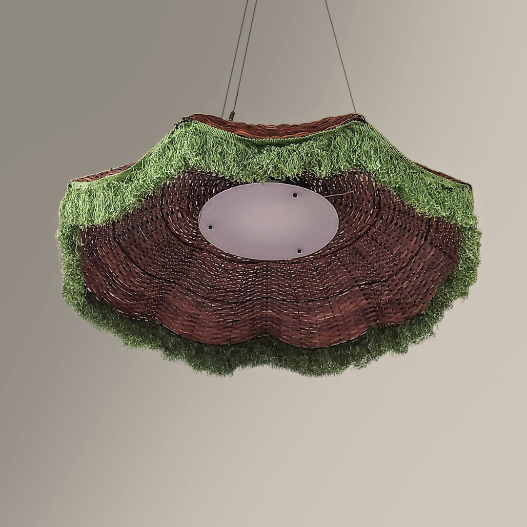 Woven pendant lampshade with grass-like texture on a plain background