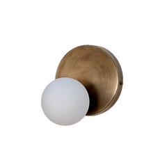 A wall sconce with a brass finish and a frosted glass globe, viewed from above.