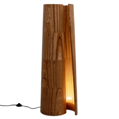 Wooden floor lamp close-up detail of its stacked reclaimed-plywood split with a warm glow