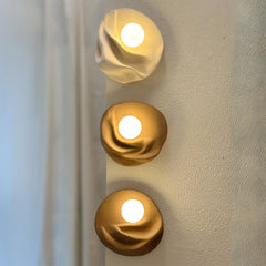 Modern Folds Wall Light casting soft glow in hallway