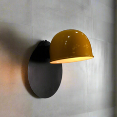 Side view of Industrial Half-Dome Wall Sconce- matte black wall plate with vivid yellow half-dome metal shade