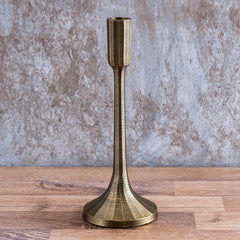 Sanee Candle Holder,  tall antique brass finish with a textured surface.