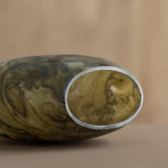 Marbled Bella Green Vase with a metallic rim on a beige background