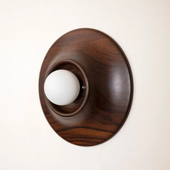 Wooden Paten Wall Light fixture made of teakwood with a white bulb 