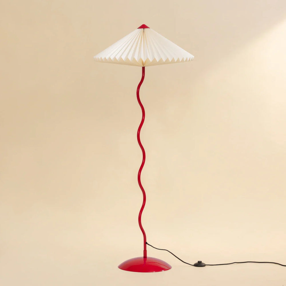 Wavy Floor Lamp - Crimson Red full view showing its white hand-pleated paper shade and red curved stand
