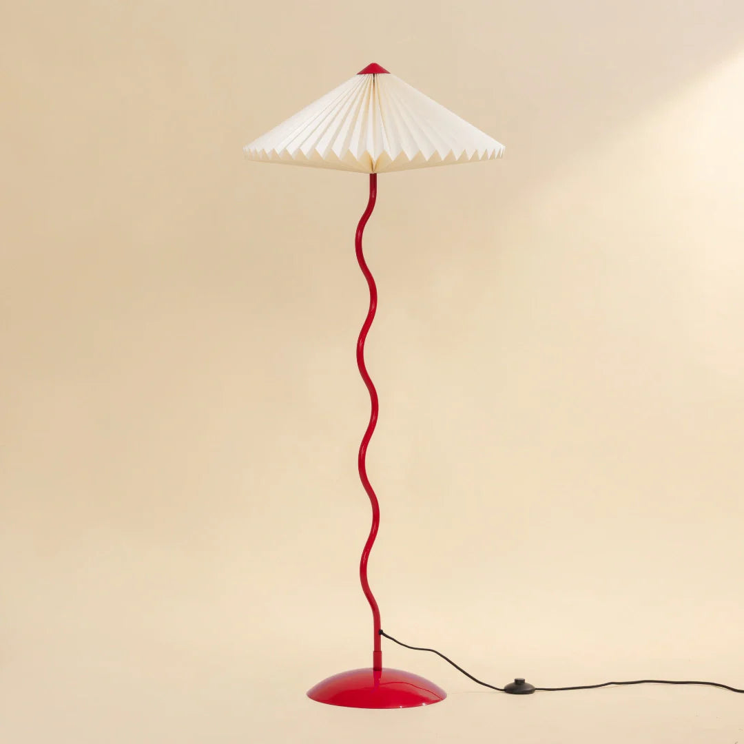 Wavy Floor Lamp - Crimson Red full view showing its white hand-pleated paper shade and red curved stand
