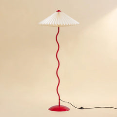 Wavy Floor Lamp - Crimson Red full view showing its white hand-pleated paper shade and red curved stand
