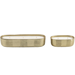 Fleur Votive- Two oval candles with gold textured holders on a white background