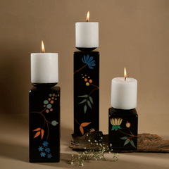 Black Beauty Candle Holder in 3 different sizes with lit candles on top
