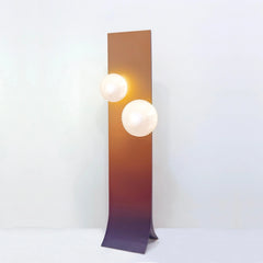 Modern Arc floor lamp shown from a side angle highlighting its golden aluminium finish
