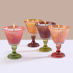 Sundae - Votive Candles - Variety - Set of 4, four lit sundae glass candles grouped on a white surface
