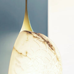Unique wall art design with lamp and marble-like texture on a gradient background for ultra modern homes