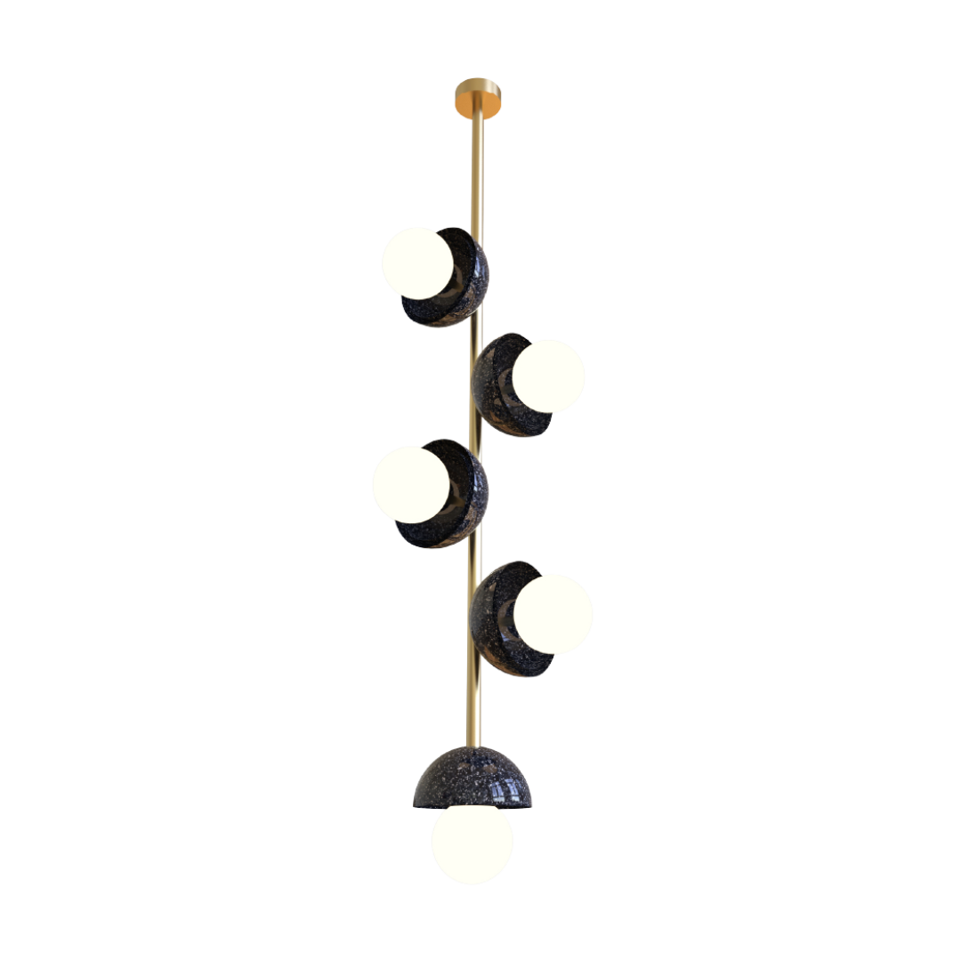 A vertical pendant light fixture with multiple opal glass globes and a brass metal frame, suspended by a chain.