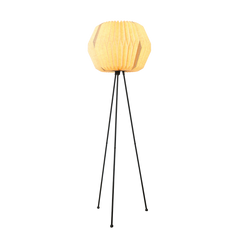 Lifo floor lamp with a white origami-inspired linen shade and a black knock-down tripod stand with warm ambient glow