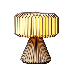 A beige origami paper table lamp with a conical pleated shade, illuminated, placed on a wooden surface.