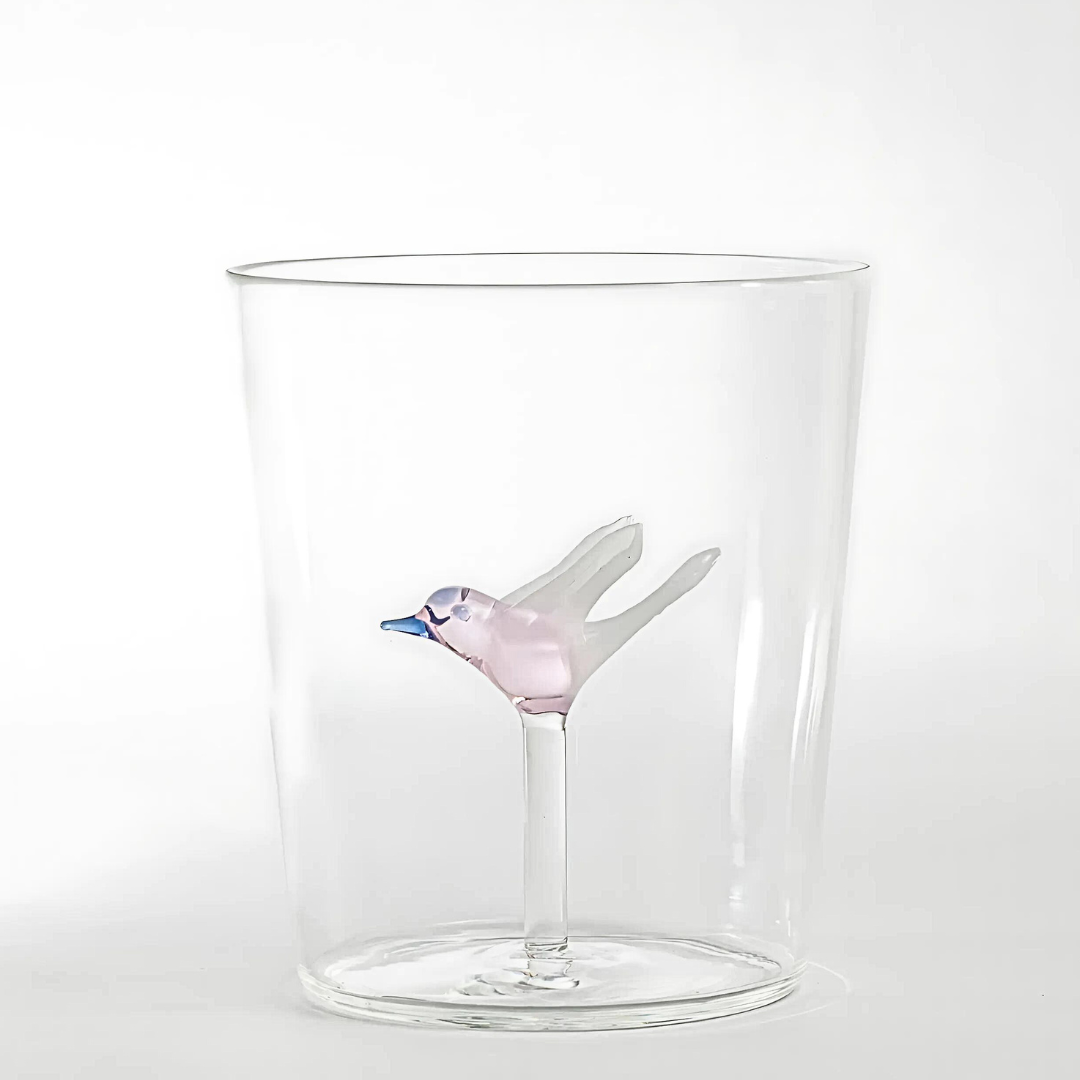 Eileen Drinking Clear glass tumbler with a decorative bird figure on a white background