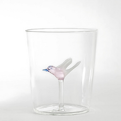 Eileen Drinking Clear glass tumbler with a decorative bird figure on a white background