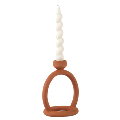 Decorative terracotta candle stand with cylindrical white candle