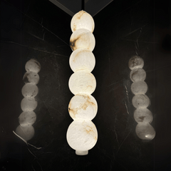 Designer alabaster hanging pendant with warm lighting
