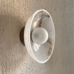 Crescent arc wall sconce emitting up and down warm light
