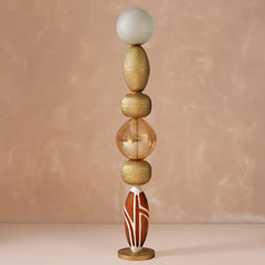 Lagori Black Floor Lamp full view showing its black and white double-cast glass and frosted sphere