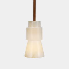Close look of pendant light with an alabaster white shade and rose gold plated steel suspended by a cable.