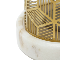 Gold candle holder on a white marble base 