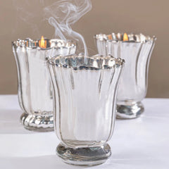 Silver Blossom - Votive Candle - Silver - Santal Blush - Set of 3, three votives with smoke rising from a snuffed wick