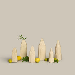 Miniature Clock Tower Vases, set of six ceramic vases in a row with lemons and greenery