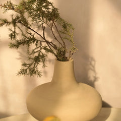 Verona Vase - unique table decor with green branches placed inside the vase against a warm-toned background