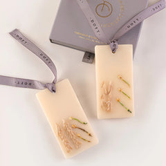 Night Jasmine - Wax Tablet - Set of 2, two tablets with pressed botanicals on grey ribbons beside gift box