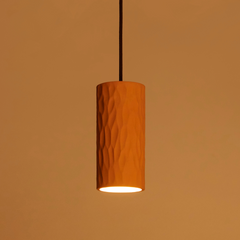 Nerl Pendant Lamp in Orange color against a matching brown background