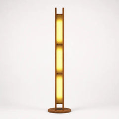 A modern minimalist floor lamp with a warm glowing vertical ribbed glass shade framed in dark wood, supported by a circular wooden base against a clean white background.