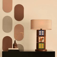 Decorative Natura Table Lamp with a beige shade and design with tiles displaying natural prints of birds and leaves.