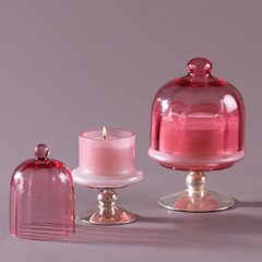 Sundance Aura Candle - Pink, lit small candle beside covered medium candle and loose cloche