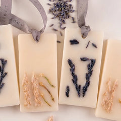 Night Jasmine & Lavender Wax Tablet, close-up of lavender and dried botanical tablets side by side