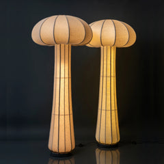Two unique floor lamps with a mushroom design on a black background