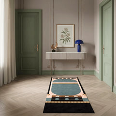 Decorative rug on a wooden floor with a console table and artwork in the background.