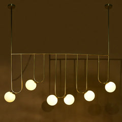 Modern chandelier light with hanging bulbs on a metal rod