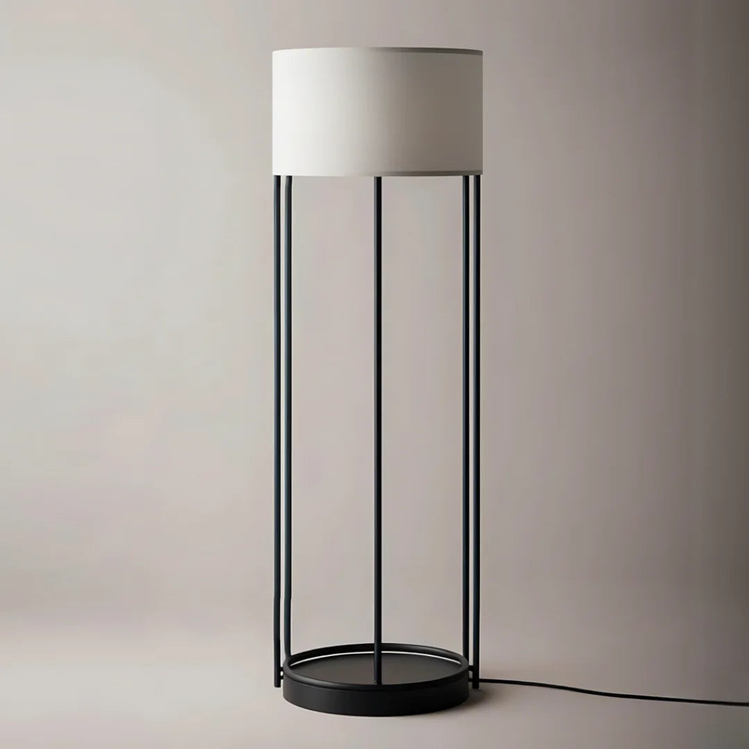 Floor lamp with a white shade and black metal base by black steel
