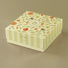Scented Candle Gift Set, closed floral and striped Doft gift box with scented candle and wax tablet.